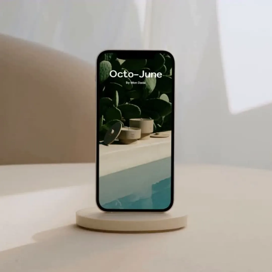 a phone showing an advertisement of outdoor candles next to a pool